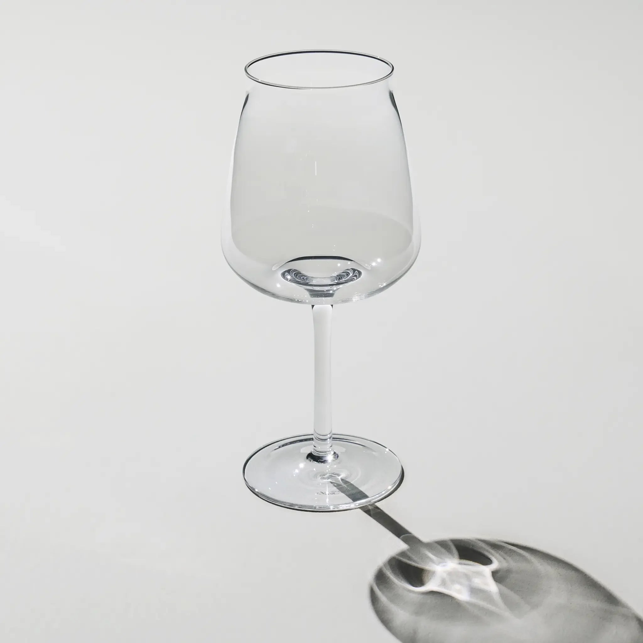 Empty Brewer’s Tower Glass – tall and slim beer glass with narrow opening and elegant stem, designed for crisp, aromatic brews.