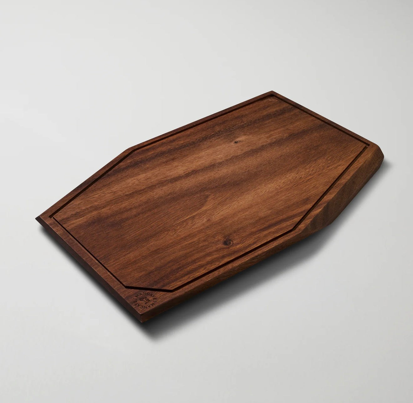 The Master´s Cutting Board - Wooden cutting board on a light gray background