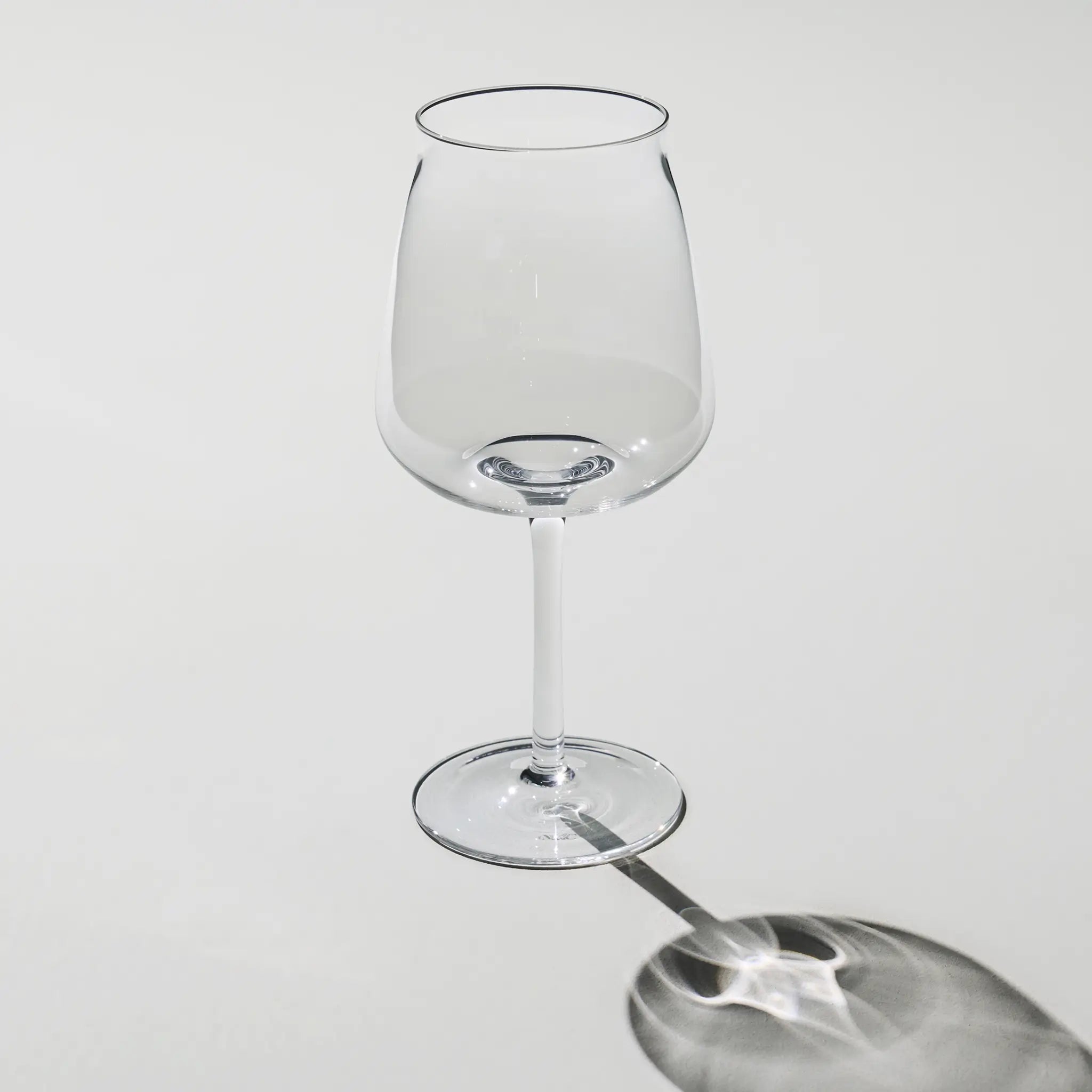 Empty Brewer’s Tower Glass – tall and slim beer glass with narrow opening and elegant stem, designed for crisp, aromatic brews.